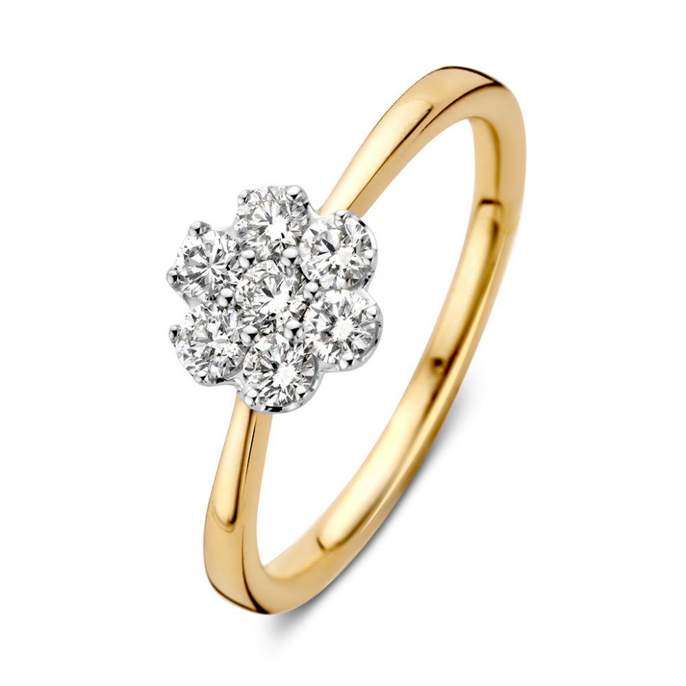 Anillo bicolor de oro amarillo y blanco con diamante de 0.51 crt en forma de flor.
