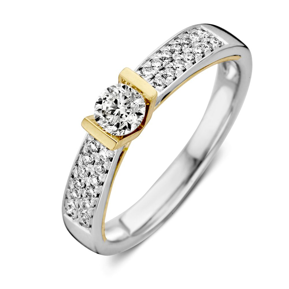 Anillo bicolor de oro blanco y amarillo para dama con diamante brillante de 0,30 crt.
