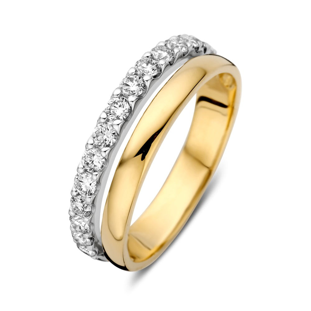 Anillo bicolor con brillantes de 0.58 crt, con una mitad dorada y otra plateada.