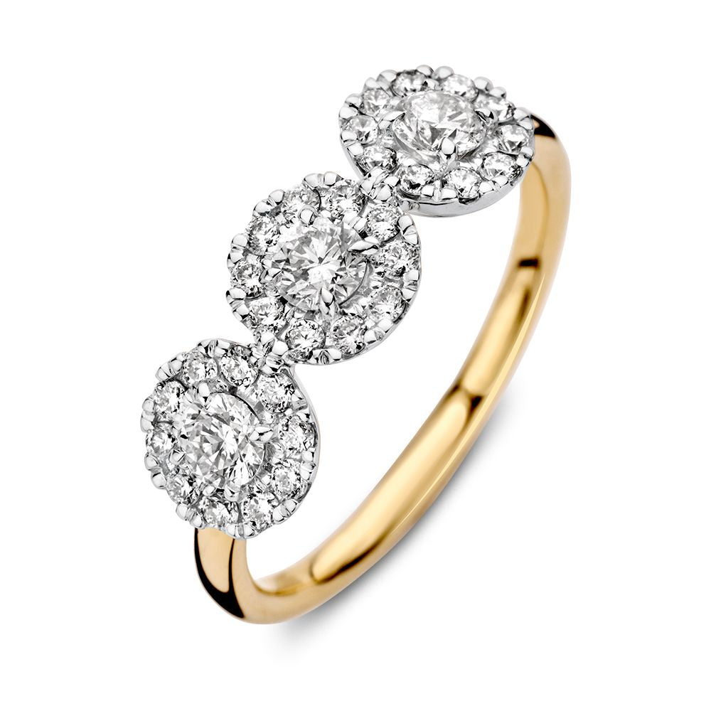 Anillo bicolor de oro de tres piedras con diamantes de 0.81ct H/SI-1 y acabado brillante.