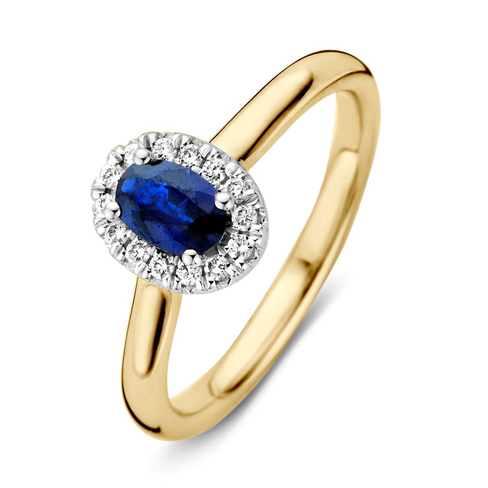 Anillo de dama de oro de 14 quilates con zafiro azul y halo de diamantes.