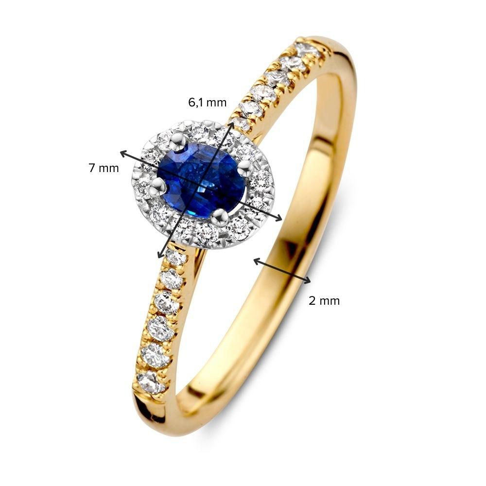 Anillo de mujer de oro bicolor de 14 quilates con zafiro ovalado azul y halo de diamantes