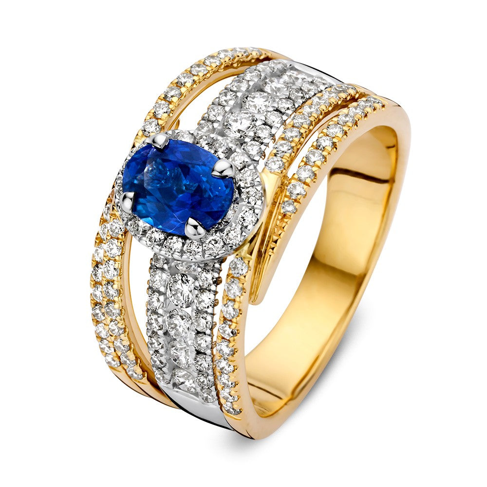 Anillo de oro con zafiro ovalado azul rey y diamantes de 1.07 ct, diseño elegante y brillante.