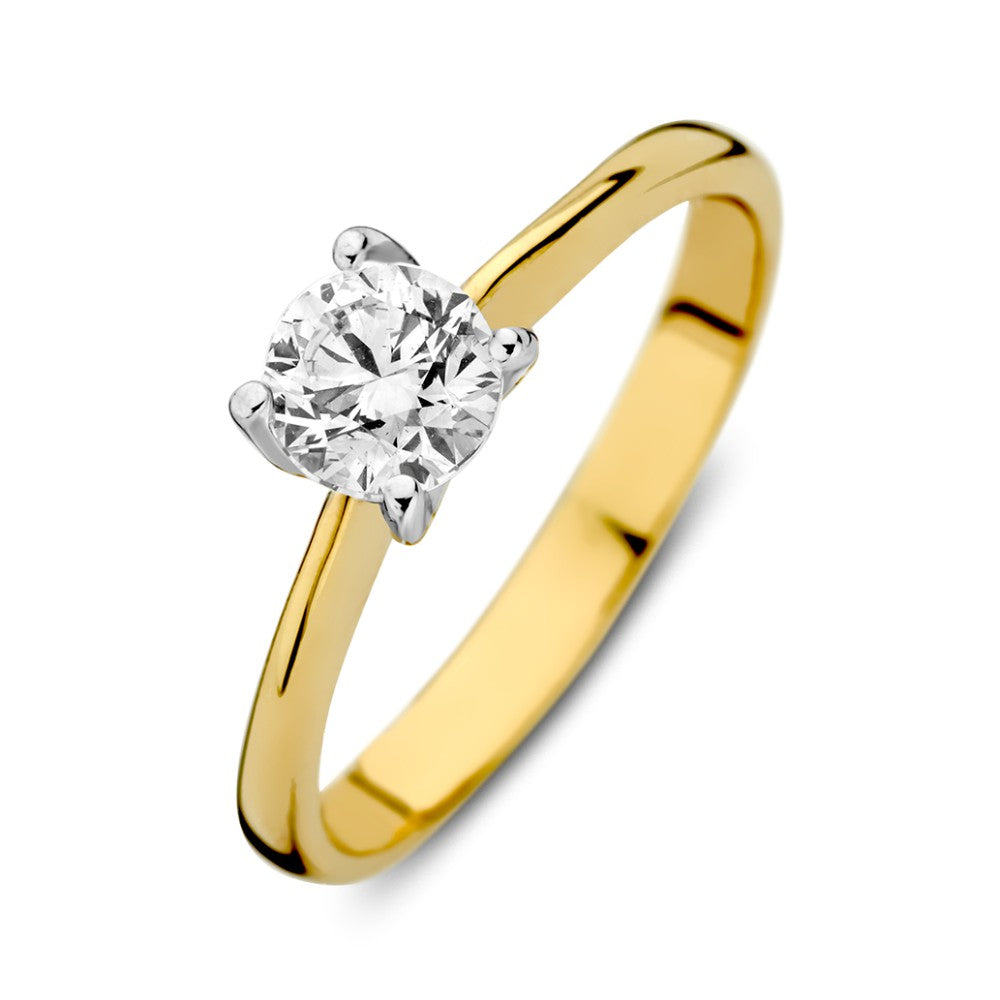 Anillo bicolor de oro blanco y amarillo con circonita, diseño sencillo y brillante.