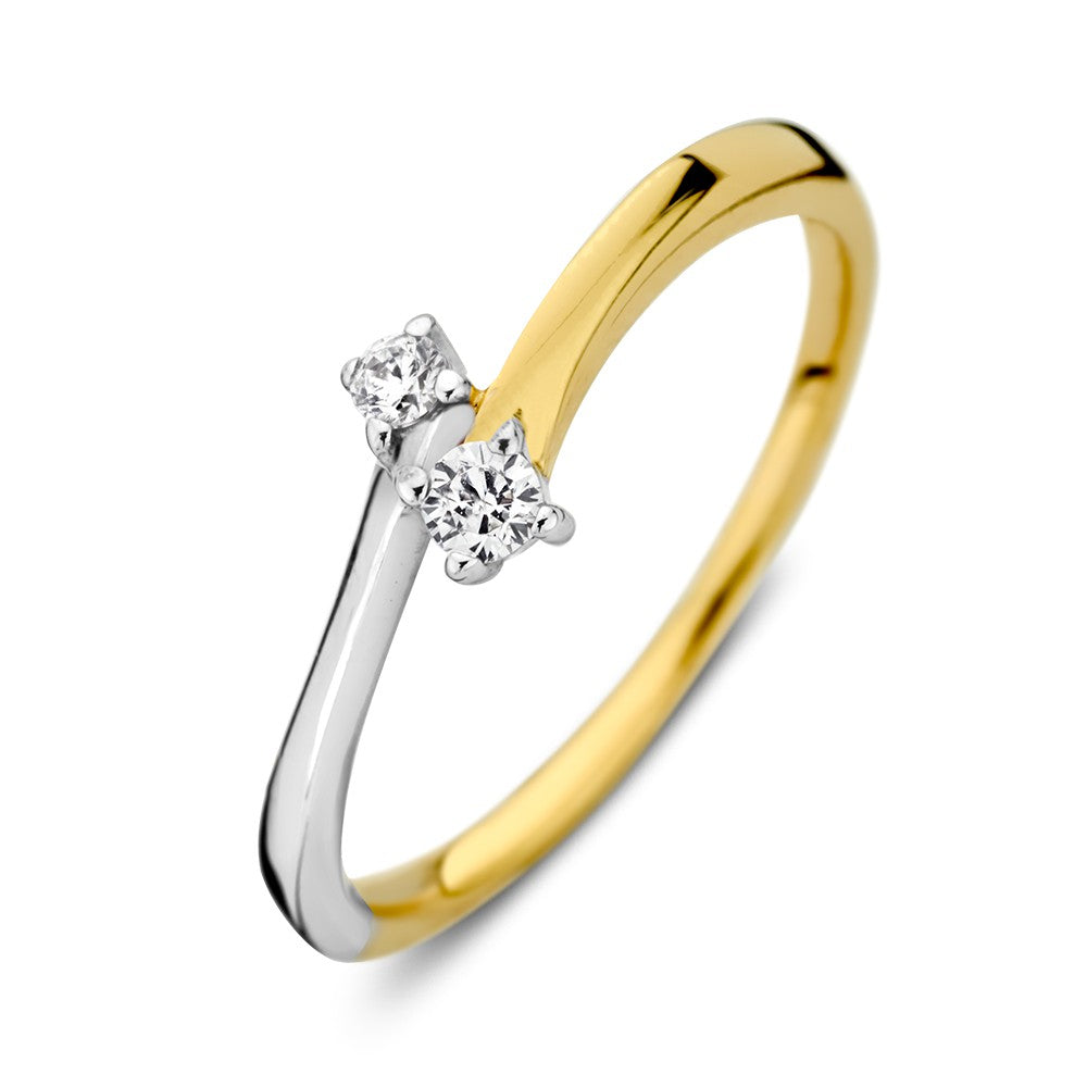 Anillo bicolor de oro blanco y amarillo con circonitas, diseño elegante y delicado.