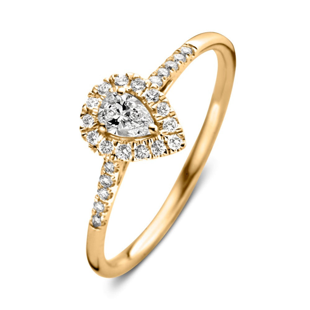 Anillo de oro amarillo con diamantes en forma de pera y pavé alrededor.