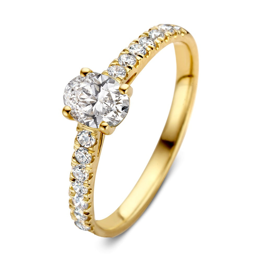 Anillo de oro amarillo con un diamante central de 0,75 crt y piedras brillantes en el aro.