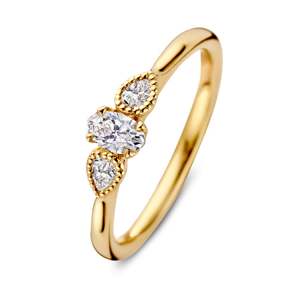 Anillo vintage de oro amarillo de 14 quilates con diamante ovalado y dos piedras en forma de pera.