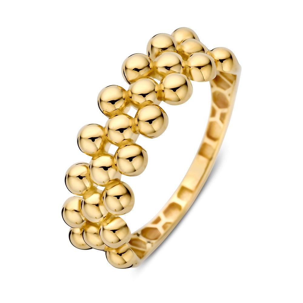 Anillo de oro amarillo con un diseño de esferas brillantes.