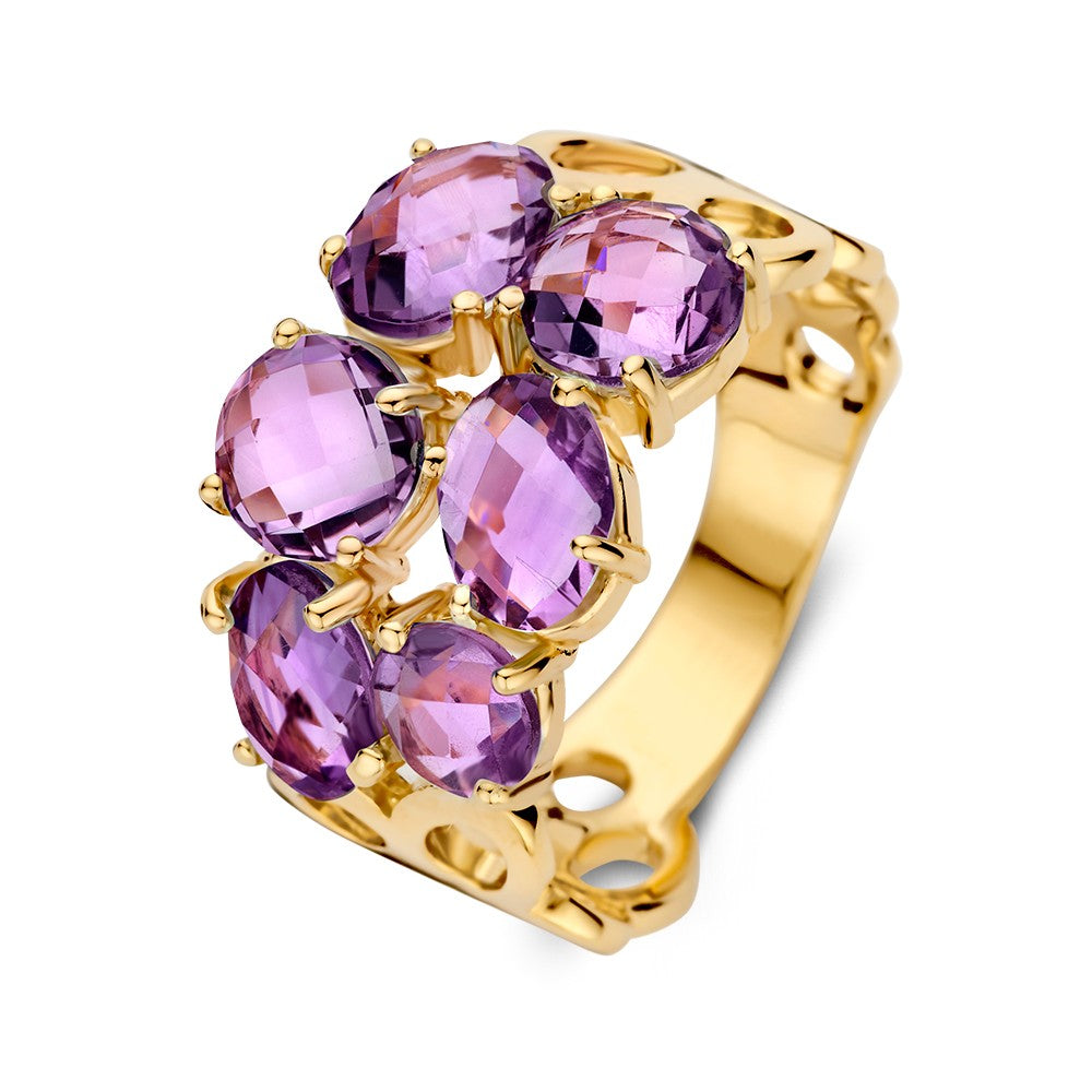 Anillo de oro amarillo con patrón orgánico y amatistas moradas.