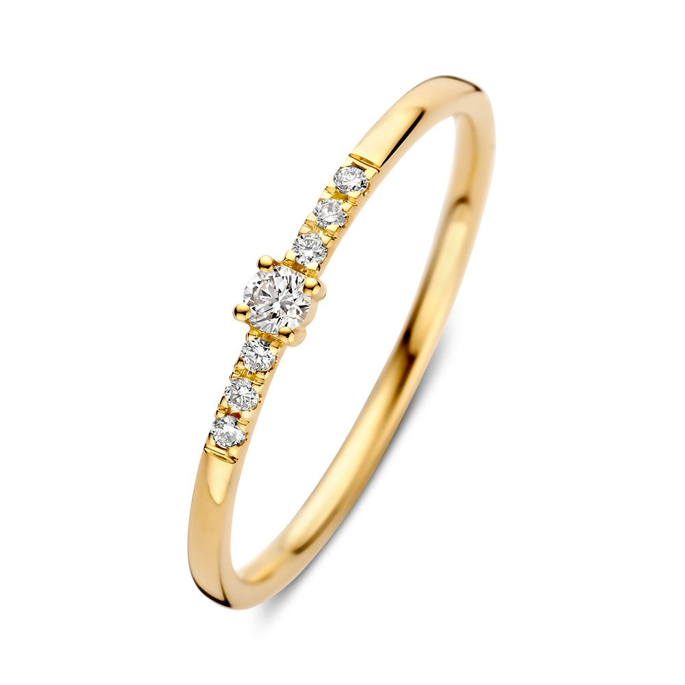 Anillo de oro amarillo con diamante central y seis diamantes pequeños en el aro.