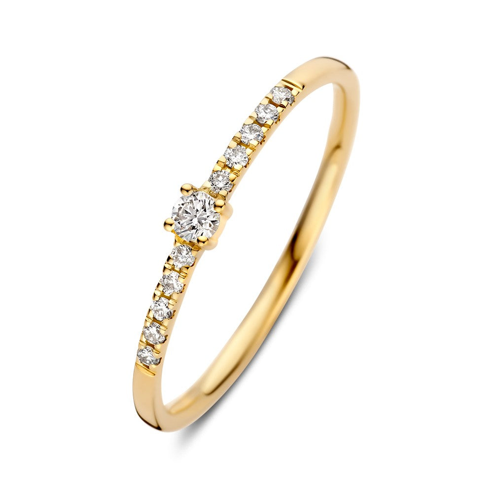 Anillo de oro amarillo con brillante de 0.12 crt y diamantes en el aro.