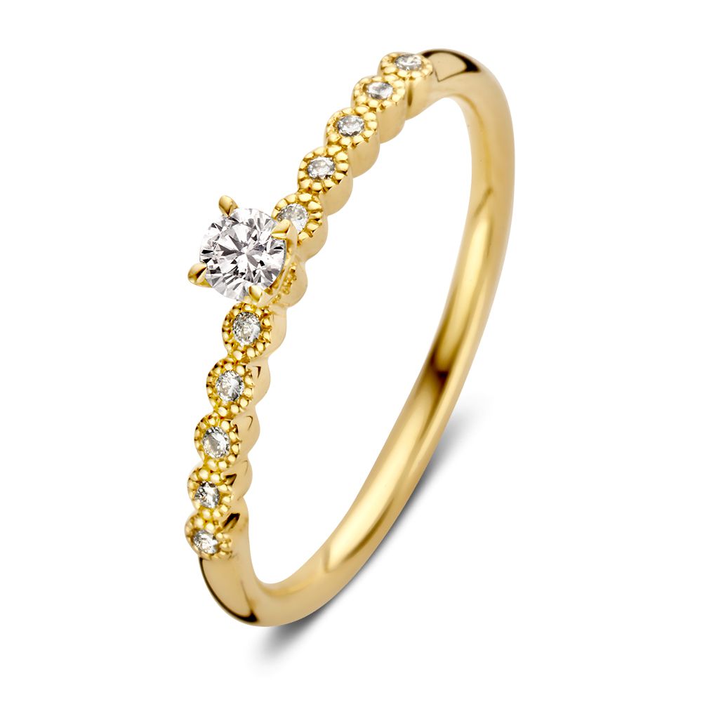 Anillo solitario vintage de oro amarillo de 14 quilates, con diamante central y piedras laterales brillantes.