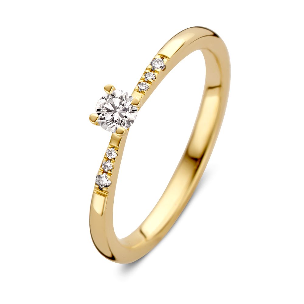 Anillo de oro amarillo elegante con piedra central de brillante y piedras laterales de 0.21 crt.