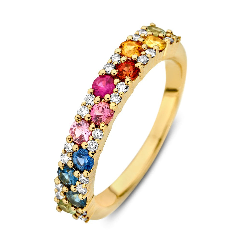 Anillo de oro amarillo con zafiros de colores y diamantes, diseño elegante y brillante.
