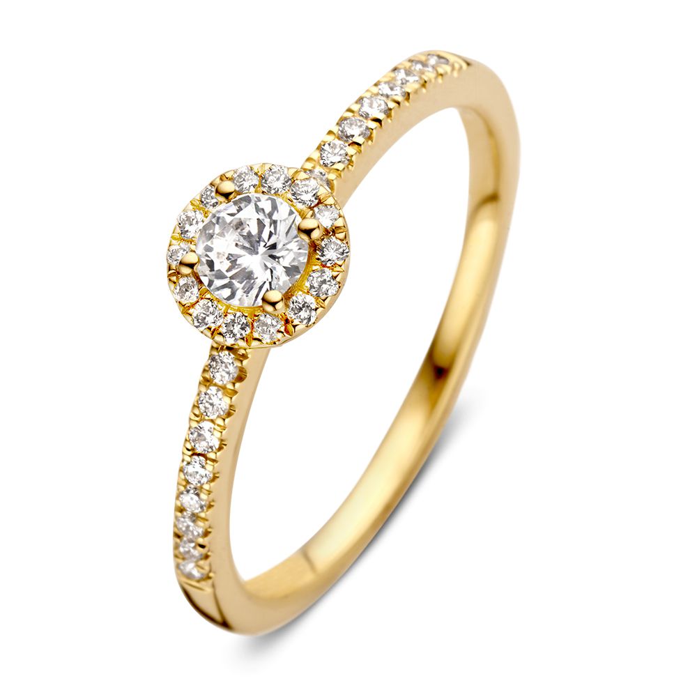 Anillo de oro amarillo elegante con un brillante de 0,20 ct y halo de diamantes.