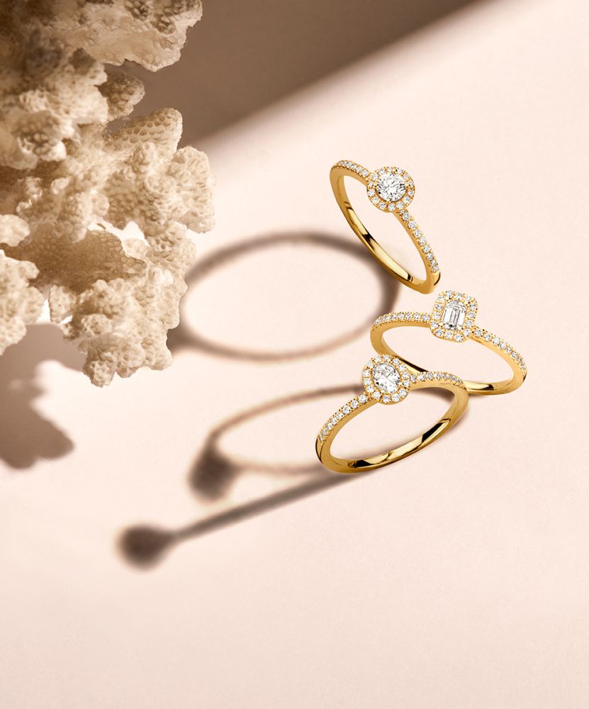 Elegante Anillo de Oro Amarillo con 0,20ct Brillante y Halo de Diamantes
