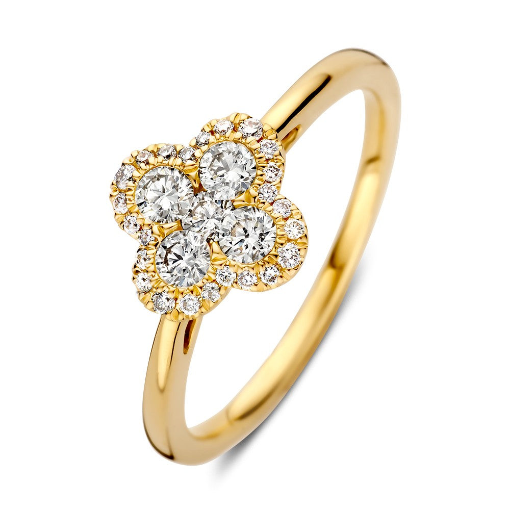 Anillo de oro amarillo con diamantes brillantes y diseño floral de tres piedras.