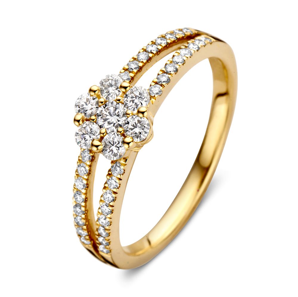 Anillo de oro amarillo con diamantes, diseño de entorno con piedras brillantes en forma de flor.