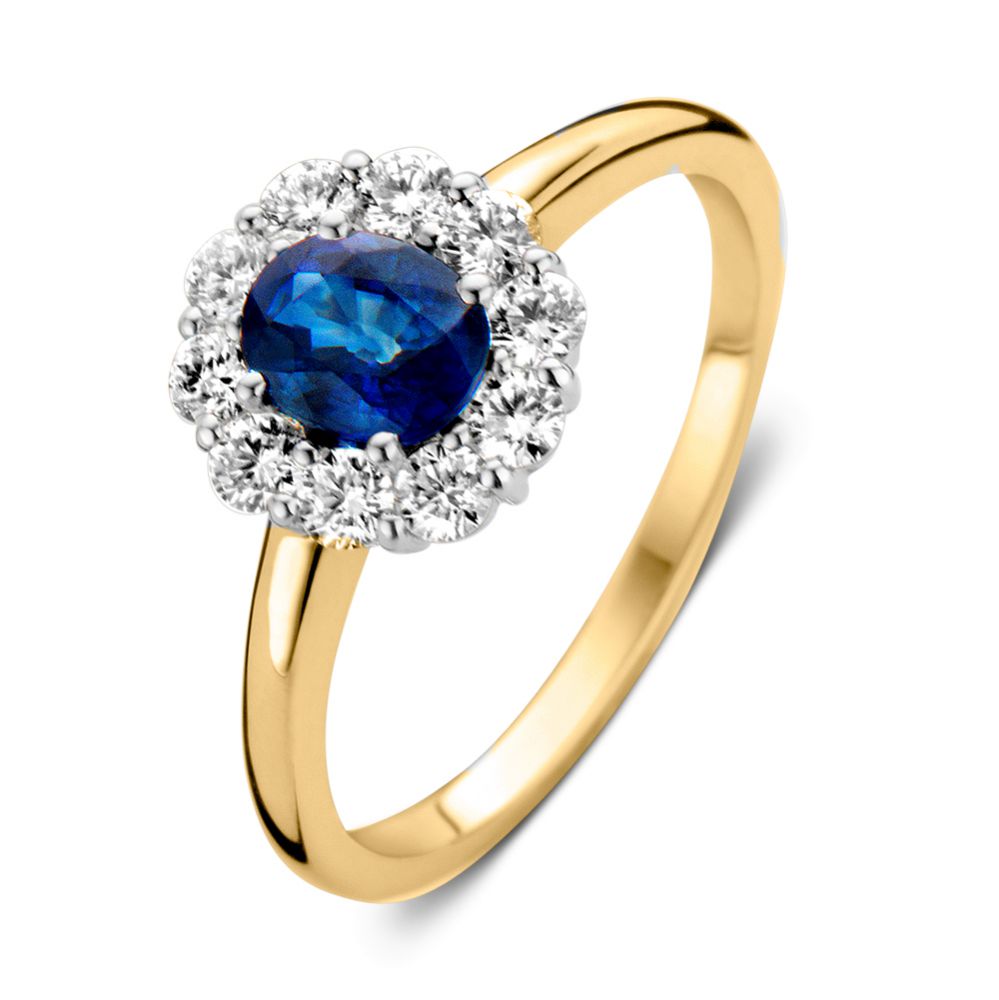 Anillo elegante de oro amarillo con zafiro azul y diamantes brillantes.