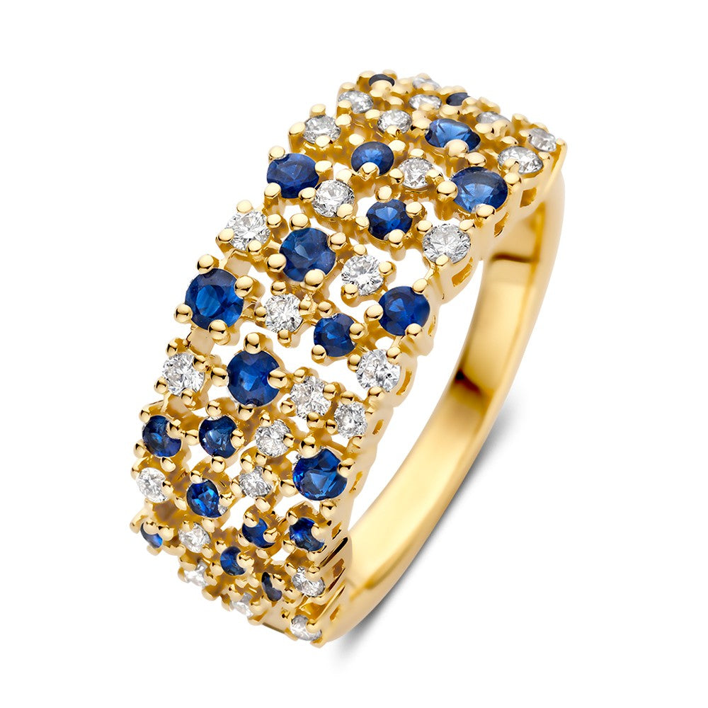 Anillo de oro amarillo con brillantes y zafiros en un diseño moderno y brillante.
