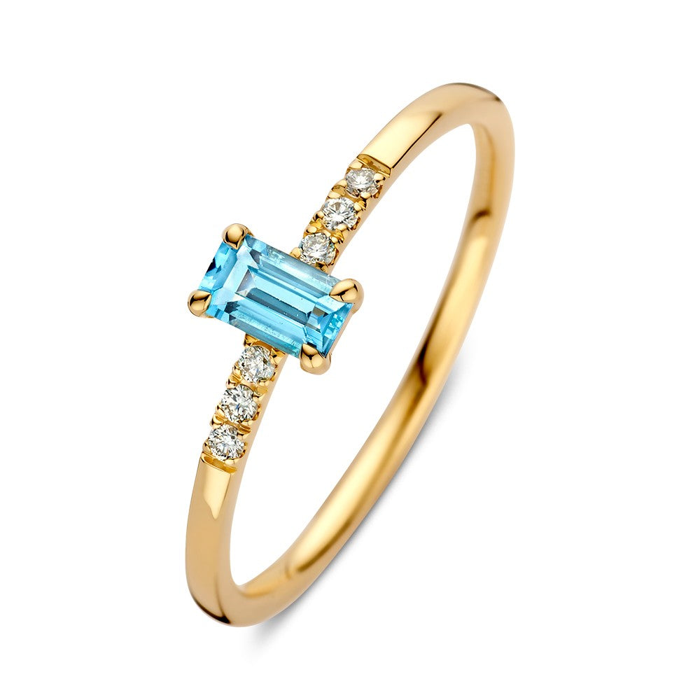 Anillo de oro amarillo con topacio y diamantes, diseño delicado y forma rectangular.