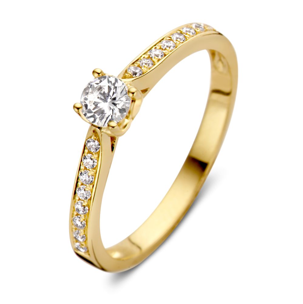 Anillo de oro amarillo de 14 quilates con diseño romántico y diamante central.