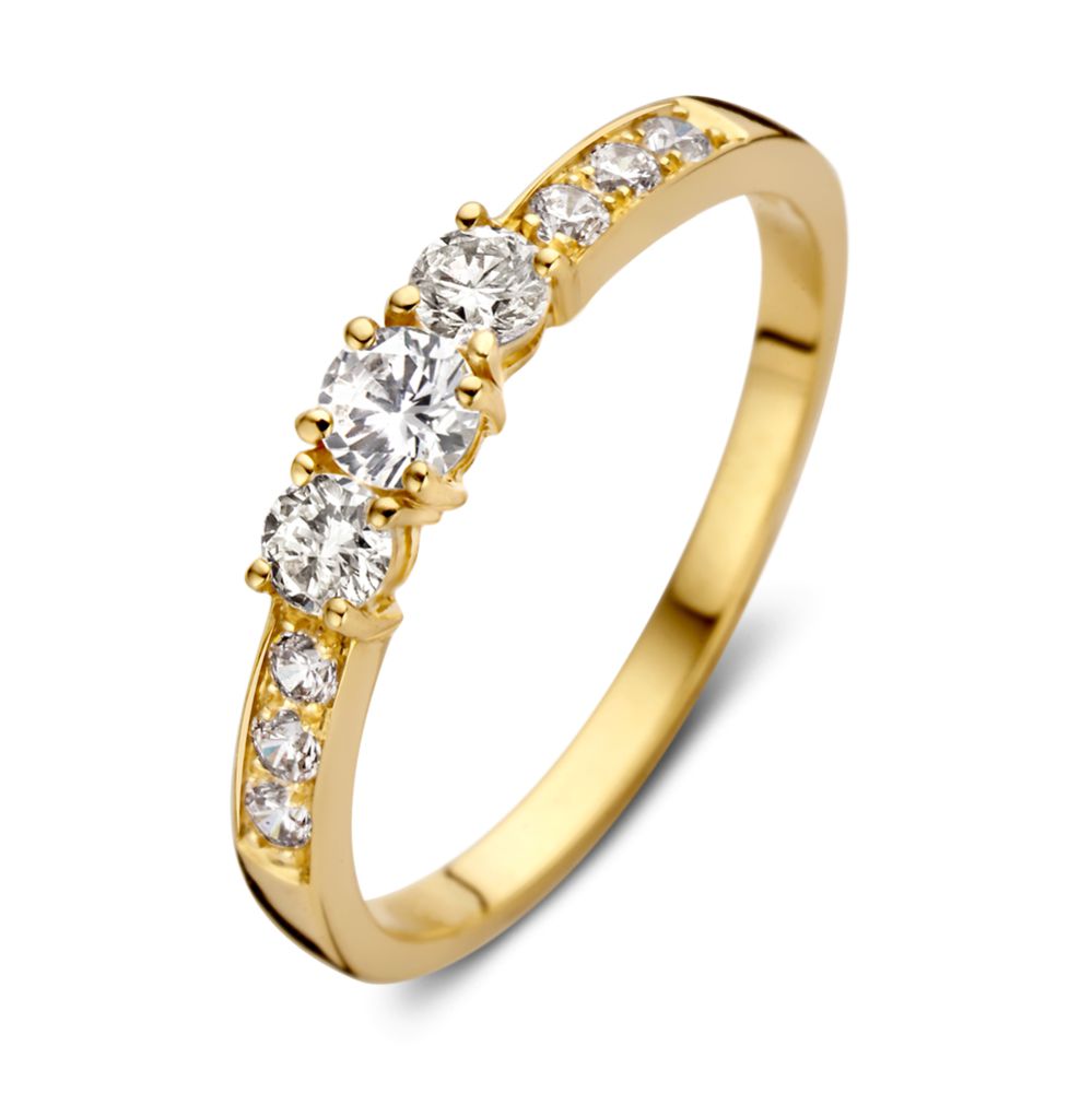 Anillo de oro amarillo de 14 quilates con circonitas, diseño sutil y elegante.