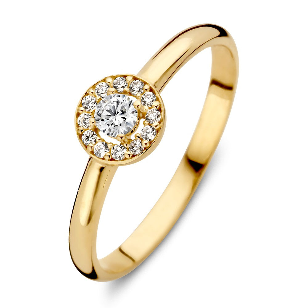 Anillo de oro amarillo de 14 quilates con circonitas, con un diseño de entorno y una piedra central brillante.