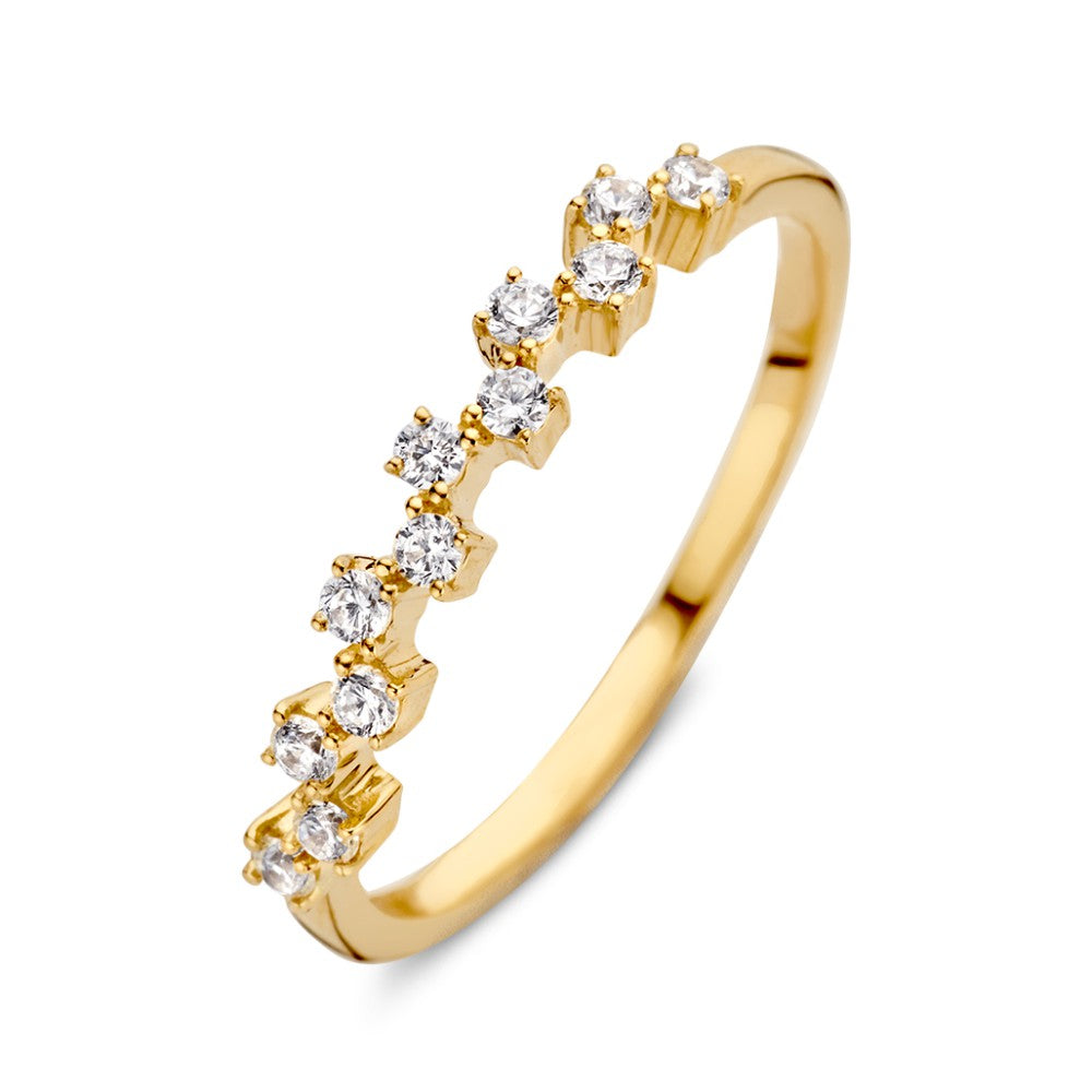 Anillo de oro amarillo de 14 quilates con zirconias brillantes en un diseño delicado.