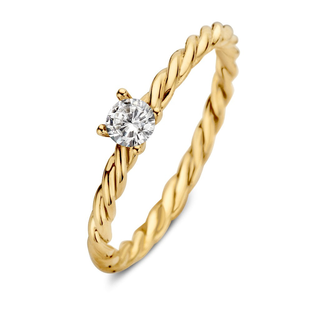 Anillo de oro con banda retorcida y circonita, destacando su diseño atemporal.