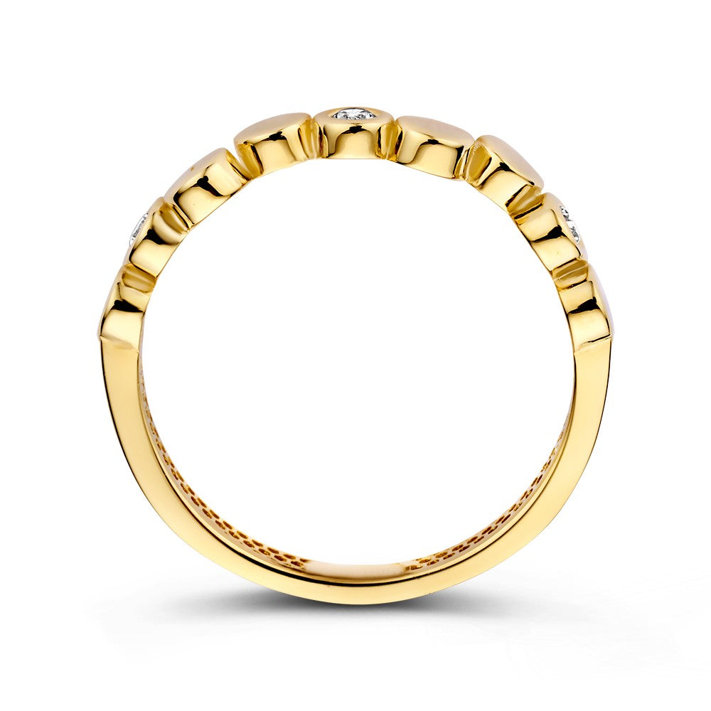 Anillo de oro amarillo con elementos redondos juguetones y brillantes circonitas