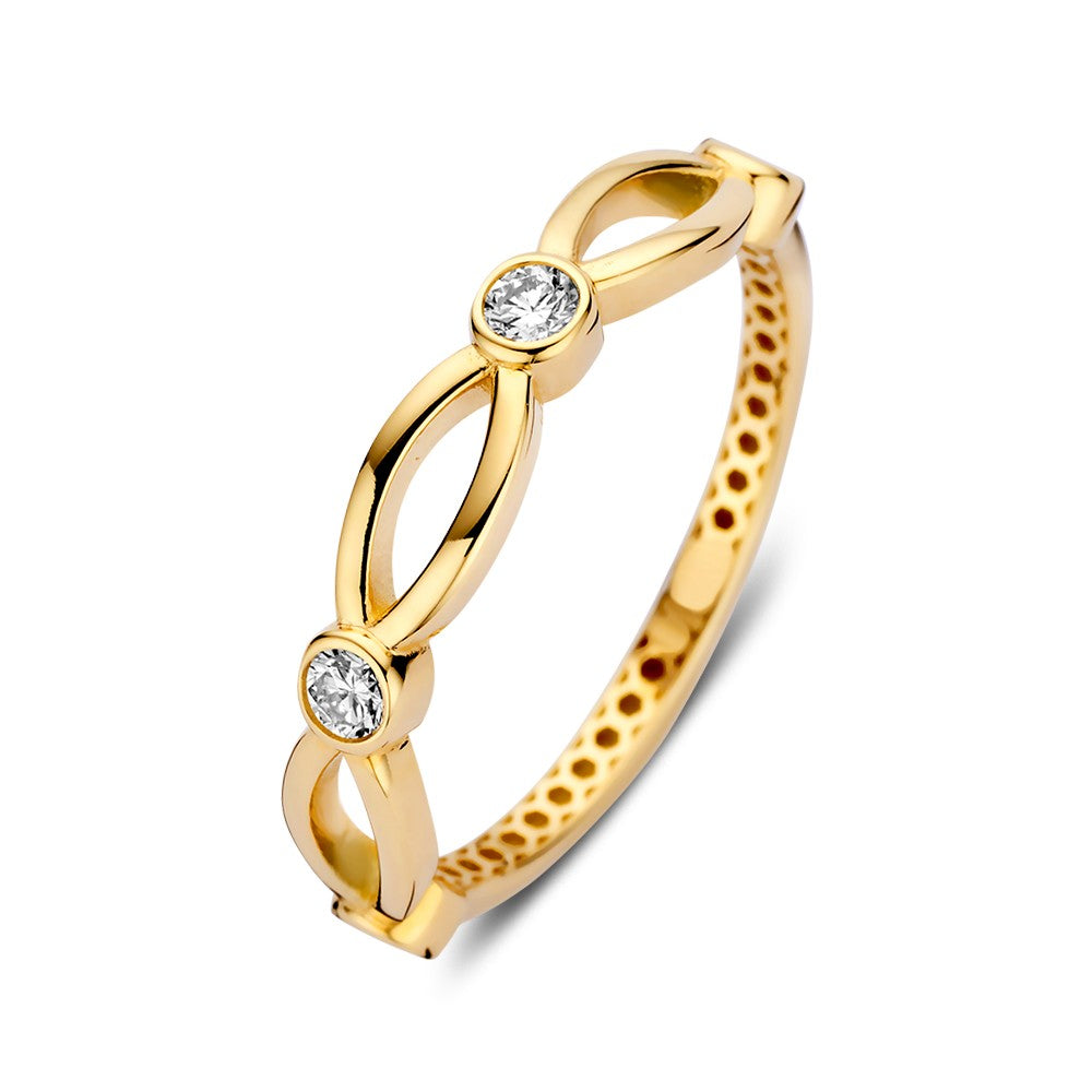 Anillo de oro amarillo con diseño juguetón y circonitas brillantes.