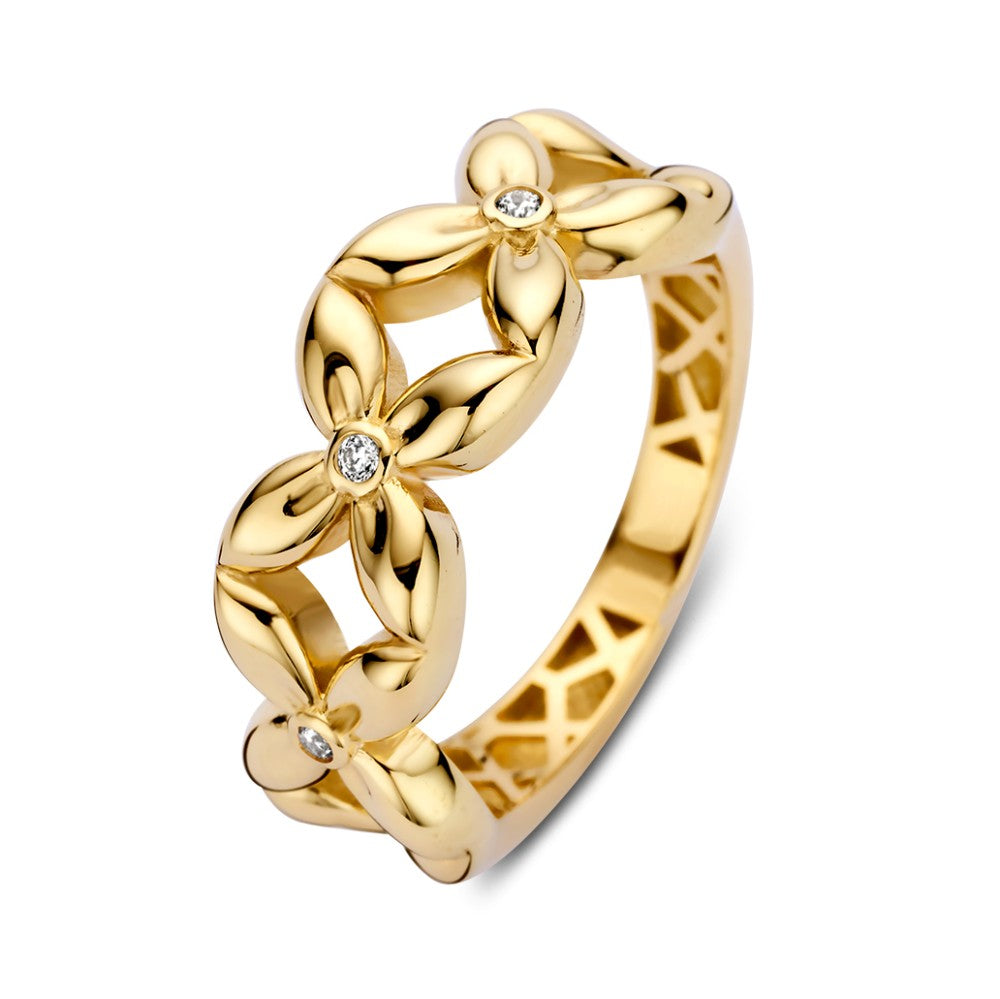Anillo ancho de oro amarillo con diseño de flores y corazones de circonita.