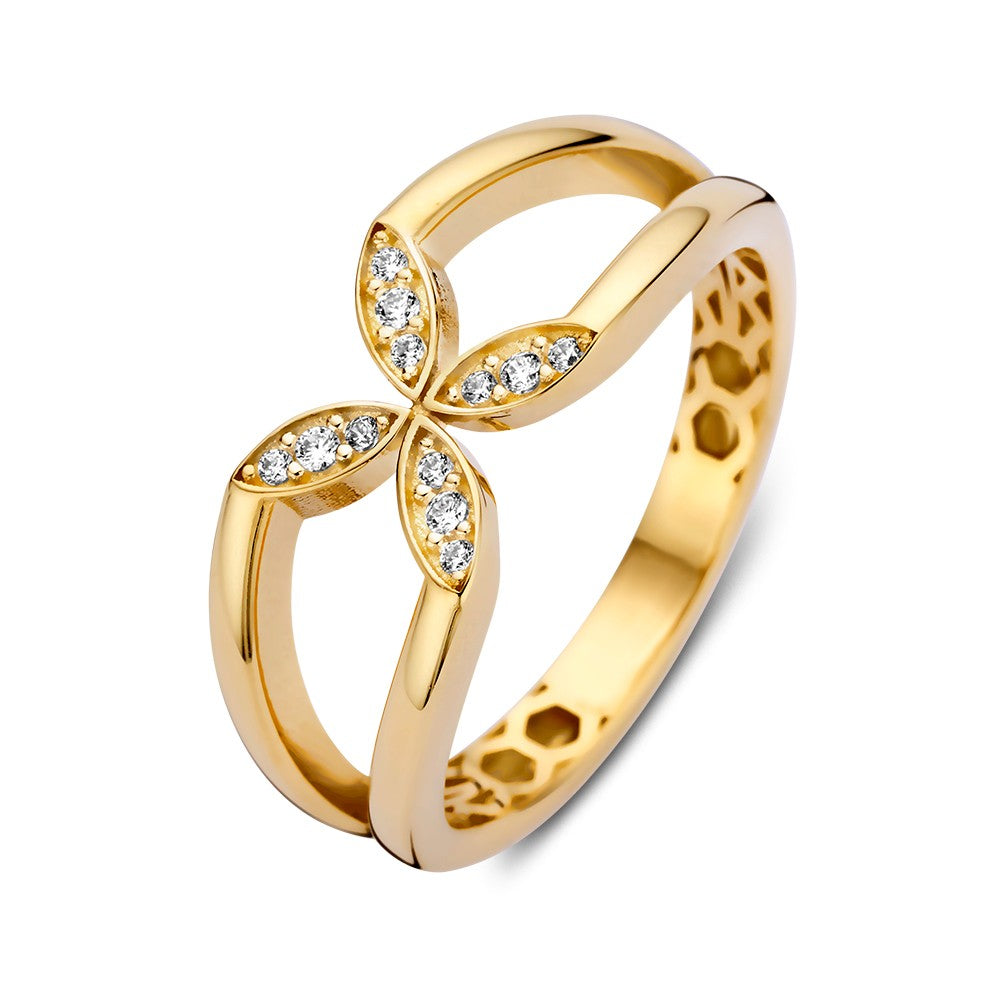 Anillo de oro amarillo con diseño de flor y detalles de circonitas brillantes.