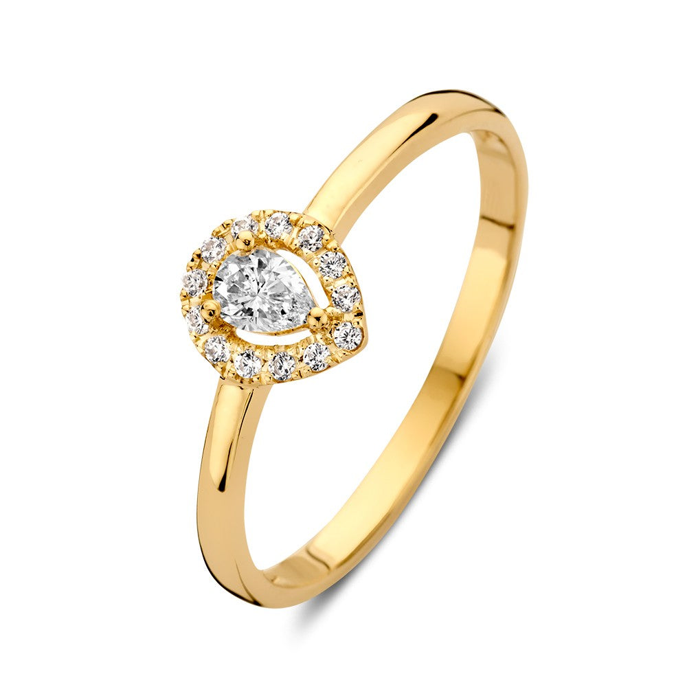 Anillo de oro amarillo elegante con zirconia en forma de pera y detalles brillantes.