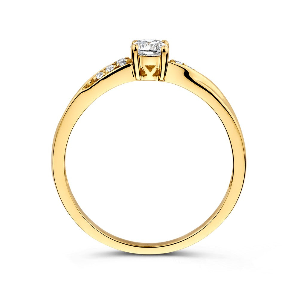 Anillo solitario de oro amarillo con circonitas y giro juguetón