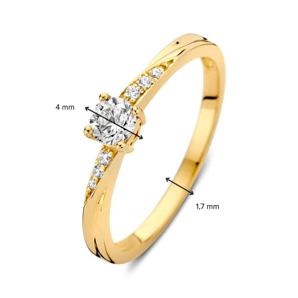 Anillo solitario de oro amarillo con circonitas y giro juguetón
