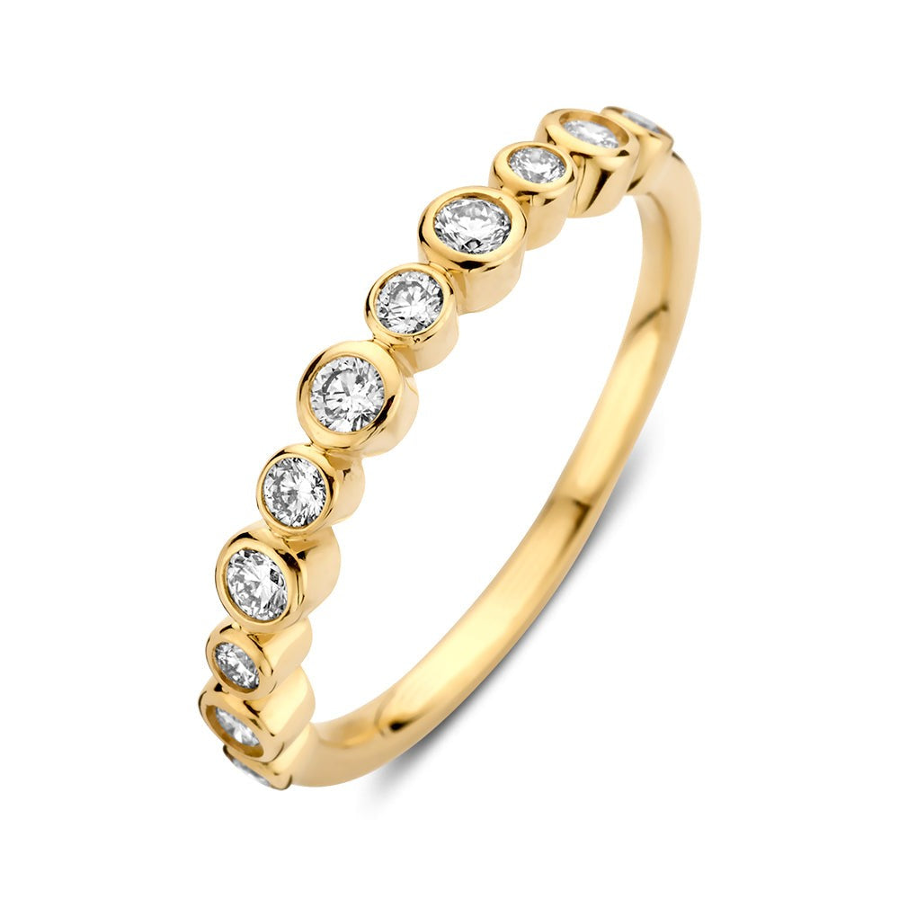 Anillo de oro amarillo con diamantes de 0,31 crt en un diseño de círculos.