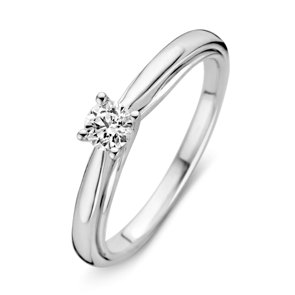 Anillo de oro blanco con un diamante brillante de 0.25 crt, diseño sutil y elegante.
