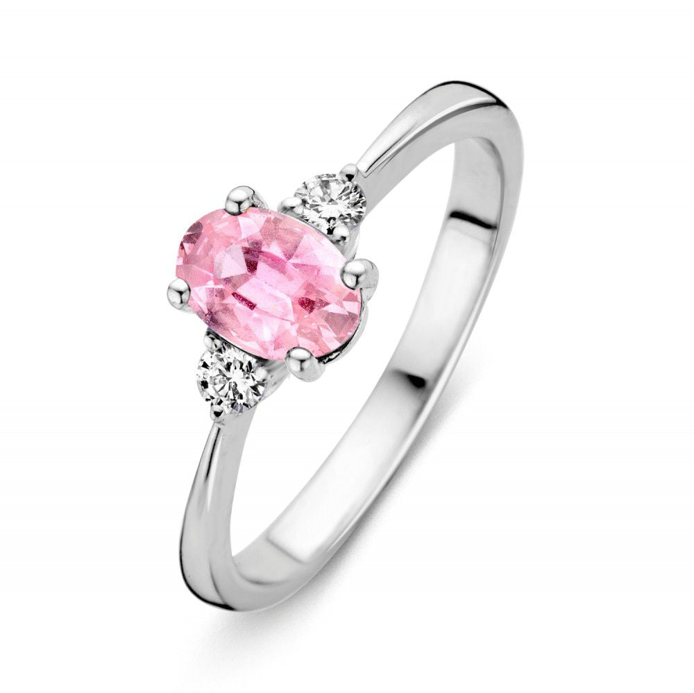 Anillo de oro blanco para dama con zafiro rosa ovalado y diamantes brillantes a los lados.