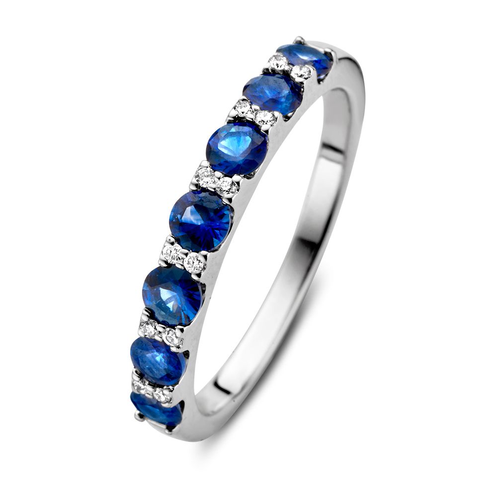 Anillo de oro blanco de 14 quilates con zafiros azules y diamantes.