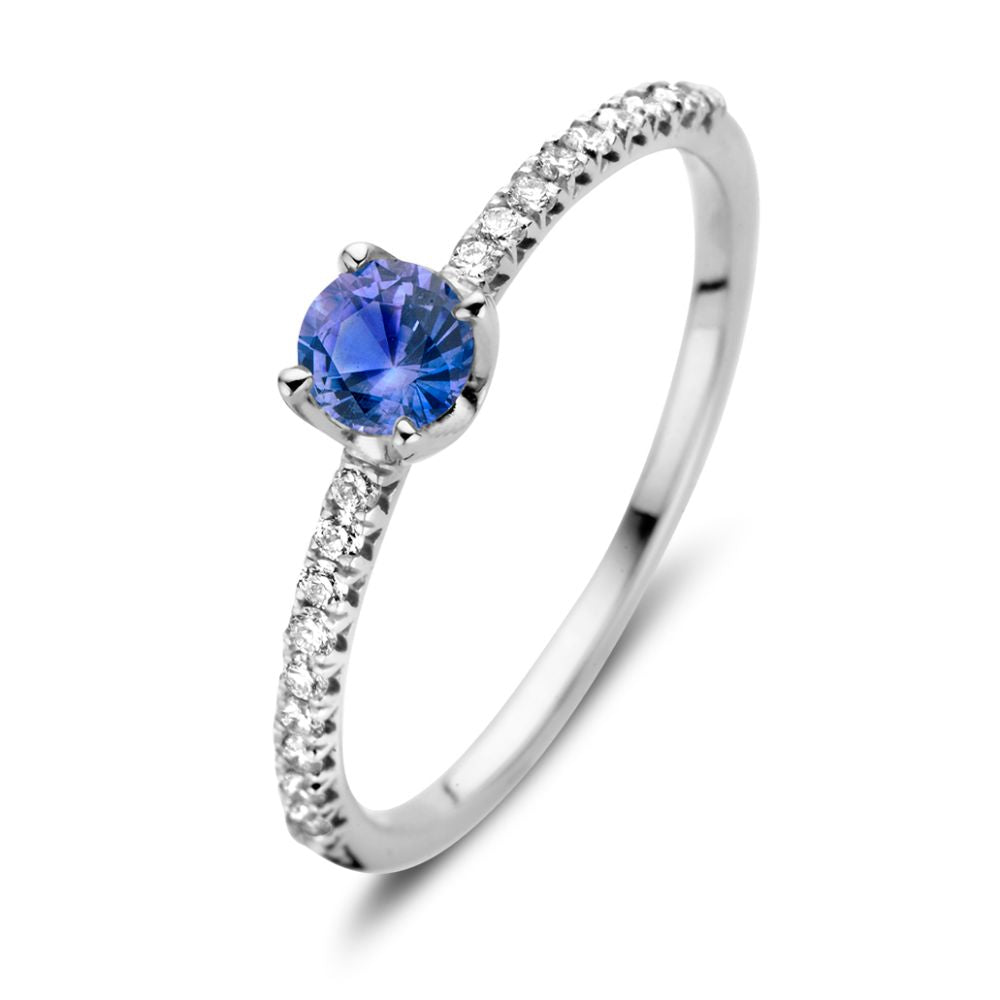 Anillo de oro blanco de 18 quilates con zafiro azul y diamantes de 0.15 ct.