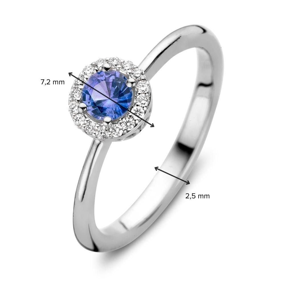 Anillo de oro blanco de 18kt con zafiro azul y diamantes de 0.11ct