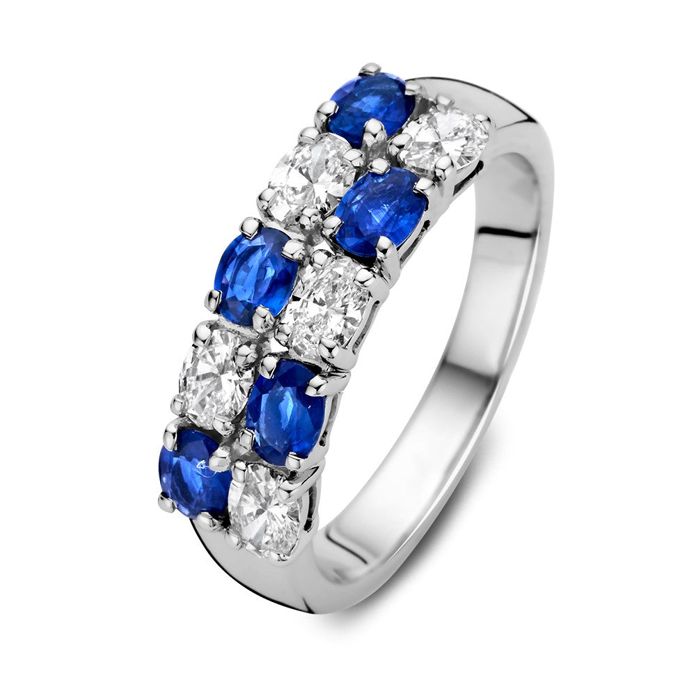 Anillo de oro blanco de 14 quilates con zafiros azules ovalados y diamantes de 0,70 quilates.