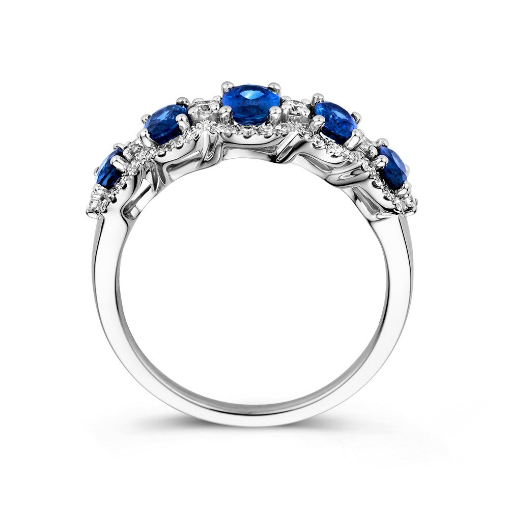 Anillo de lujo de oro blanco de 14 quilates con zafiro azul tallado en óvalo y 0,32 quilates de diamantes