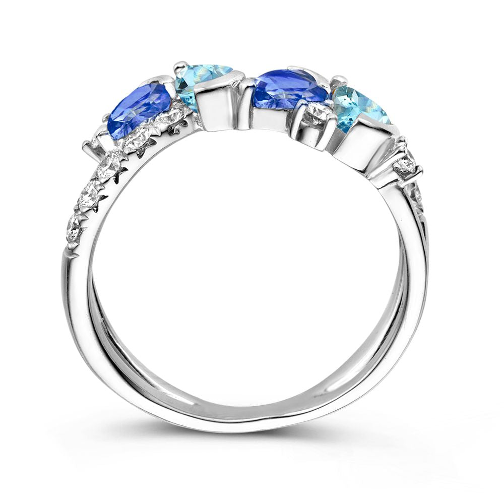 Anillo de oro blanco de 18kt con zafiro azul tallado en pera, aguamarina y diamantes de 0.50ct