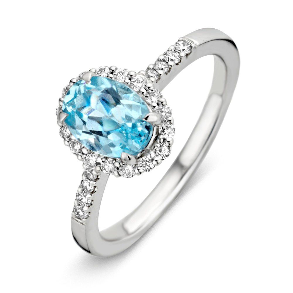 Anillo de oro blanco exquisito con topacio azul de 1.70 quilates y diamantes brillantes.