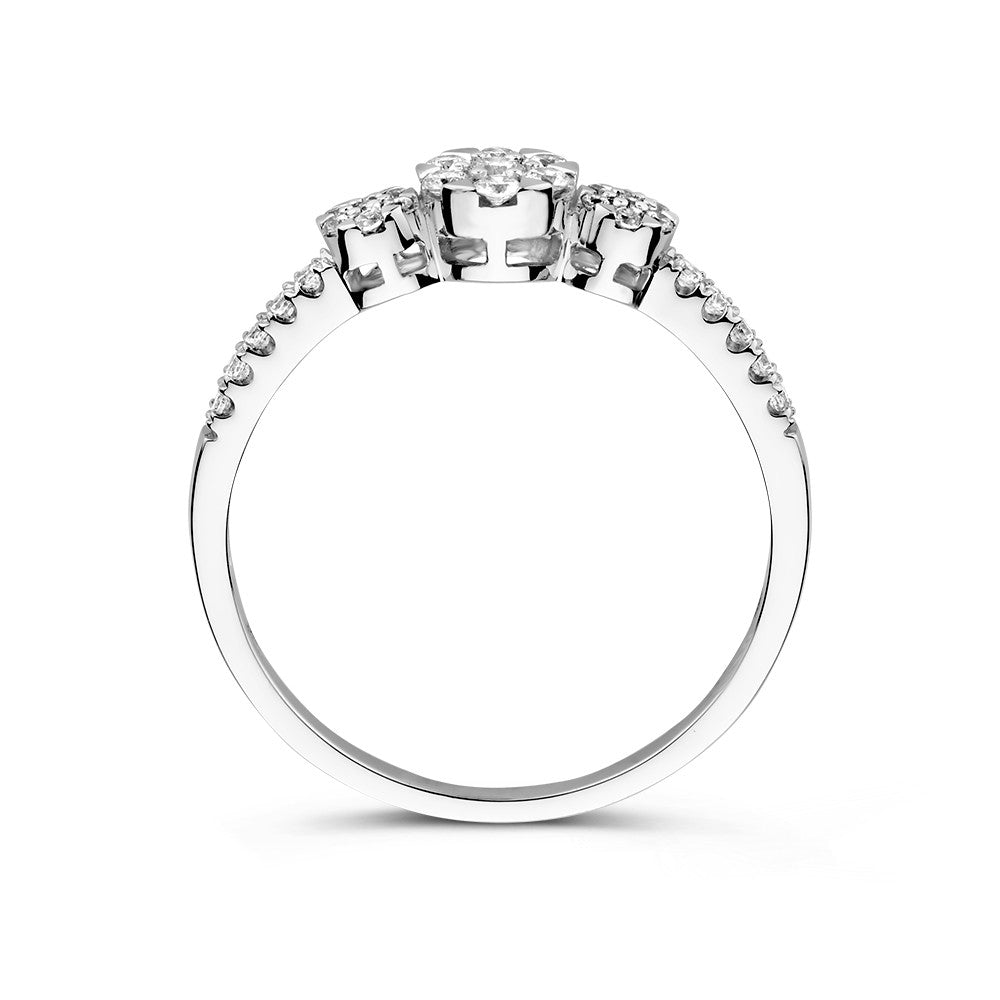 Anillo de tres piedras de oro blanco con circonitas y piedras laterales