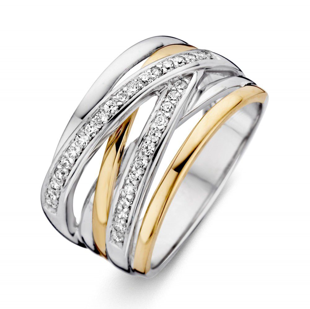 Anillo de dama en plata con engaste de oro amarillo de 14 quilates y circonitas blancas.
